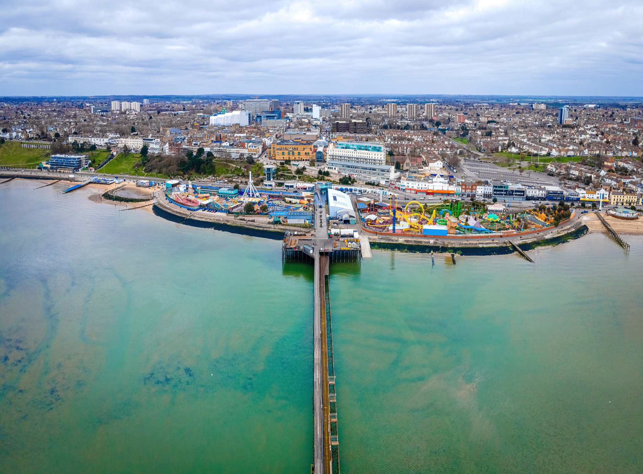Aerial view of Southend-on-Sea seafront with Southend Pier, Adventure Island and the city beyond.